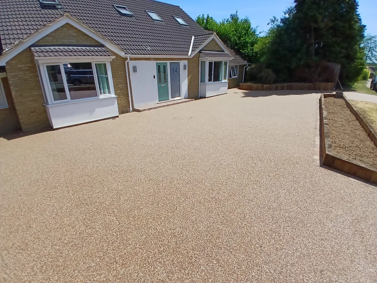 Golden resin driveway at a bungalow