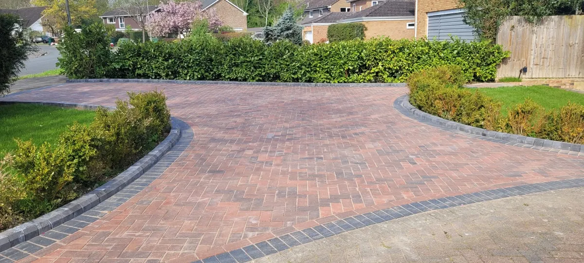 Red block paving driveway in herringbone