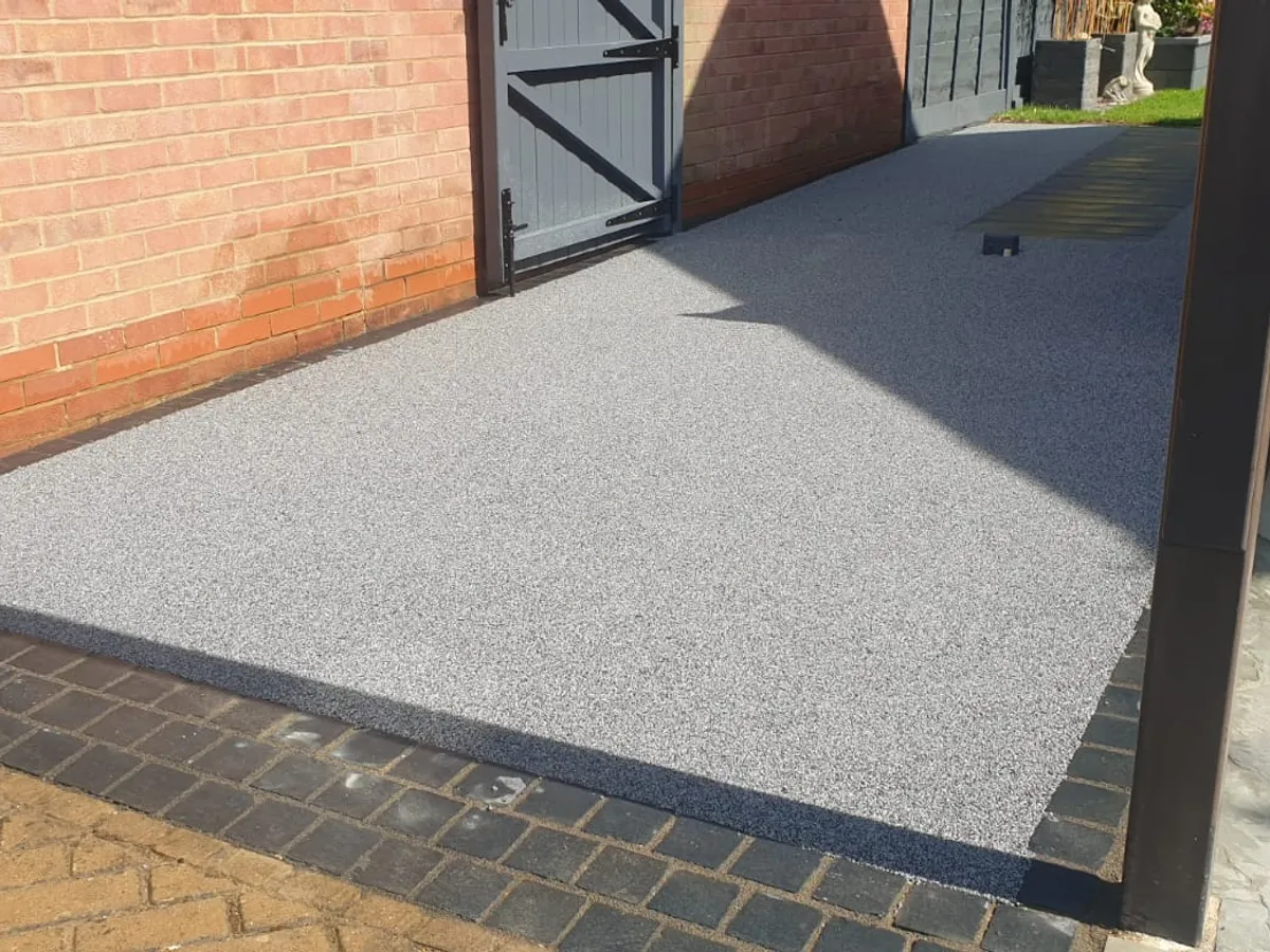 C 11 grey resin driveway with a block border