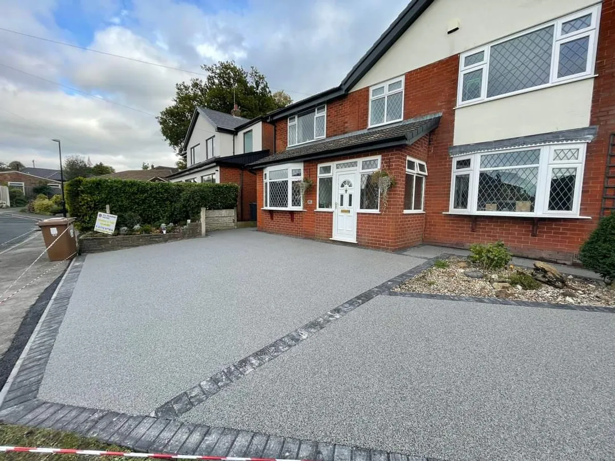 C 03 grey resin driveway in front of a semi detached house