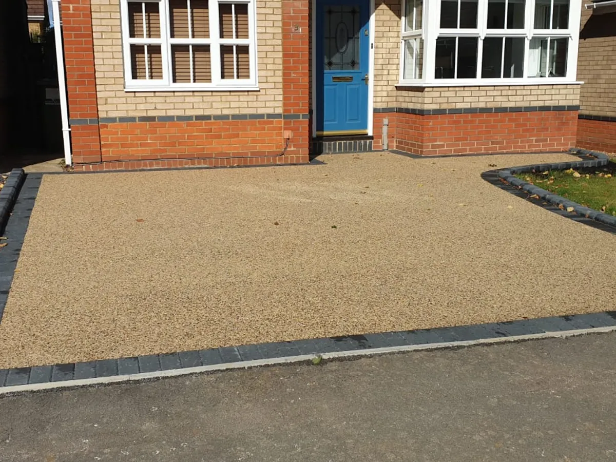C 08 golden resin driveway at the front of a house