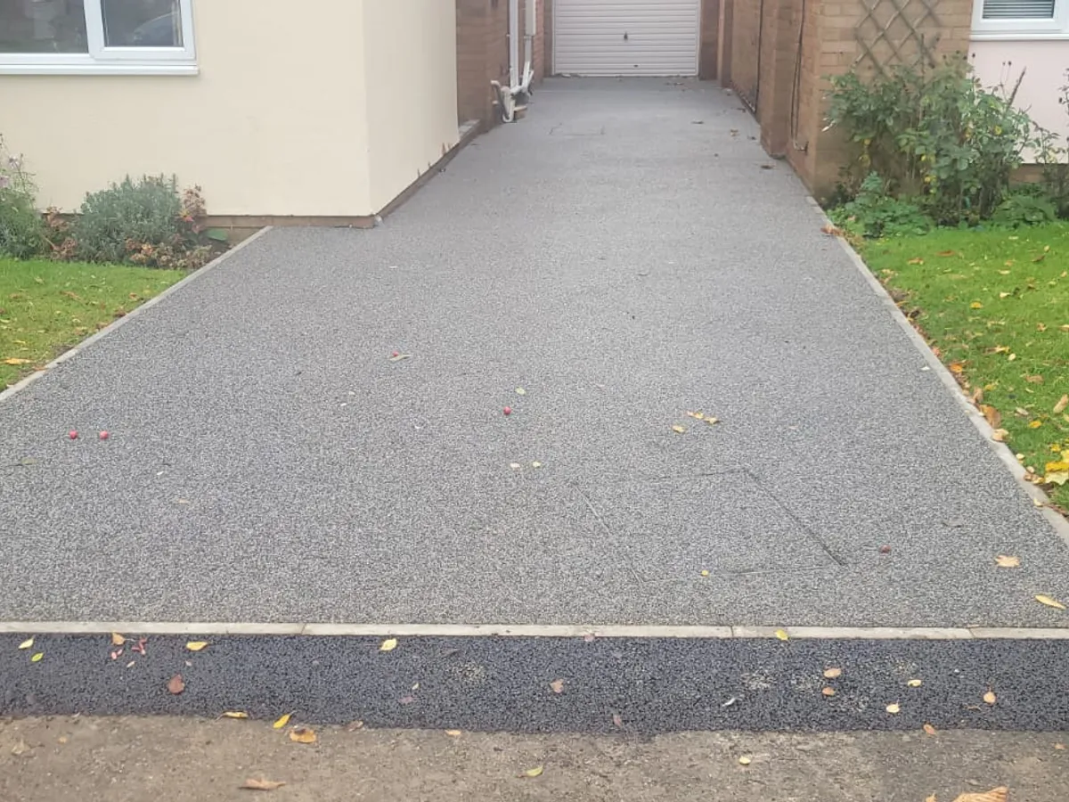 C 10 grey resin path beside a lawn